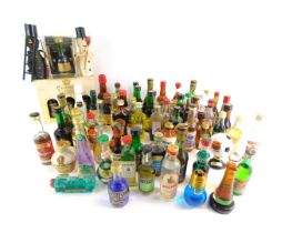 A group of alcohol miniatures, comprising whisky, vodka, and others. (1 box)