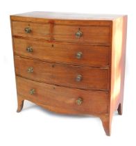 An early 19thC bow fronted mahogany chest of drawers, with two short and three long graduated drawer