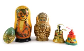 Eastern carved wooden ornaments, comprising a Russian doll, painted egg with snowy cottage scene sig
