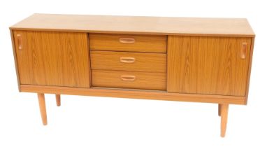 A 1970's Schreiber sideboard, with simulated teak finish, with three central drawers, and end cupboa