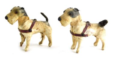 Two miniature leather dogs, 5cm high.