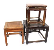 Three Chinese hardwood side tables, one with a woven rush top, 50cm high, the top 60cm x 60cm, and t