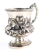 A Victorian silver Christening cup, with acanthus scroll handle and embossed floral design body, bea
