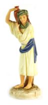 A Royal Worcester porcelain figure from the Hadley collection, modelled as Eastern Water Carrier, pr