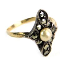 A marquise shaped dress ring, set with marcasite stones and central cultured pearl, in white gold se