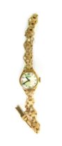 A 9ct gold cased Rotary lady's wristwatch, the circular watch head with mother of pearl dial, on a p