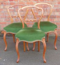 A set of three balloon back dining chairs, with green Draylon over upholstered seats