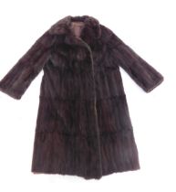 A brown mink three quarter length coat.