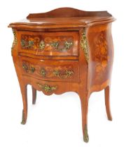 A late 19thC marquetry and tulip wood bombe chest of two drawers, in the French 18thC manner, having