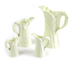 A set of four Royal Worcester graduated white cabbage leaf jugs, green printed marks to underside, t