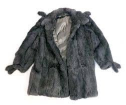 A grey rabbit fur short jacket, size 12.