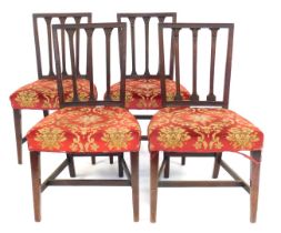 A set of four 19thC mahogany rail back dining chairs, each with a padded seat, on square tapering le