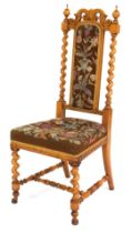 A Victorian walnut hall chair, with barley twist column supports, with tapestry seat and back.