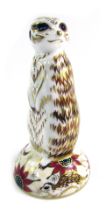 A Royal Crown Derby porcelain paperweight modelled as Meerkat, gold stopper and red printed marks, 1