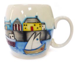 A Moorcroft pottery mug, depicting a harbour scene, impressed marks to underside, and paper label, 9