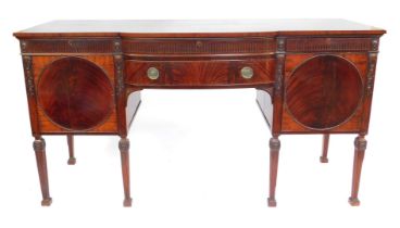 An early 20thC figured and flame mahogany Adam Revival sideboard, with bowed breakfront, fitted with
