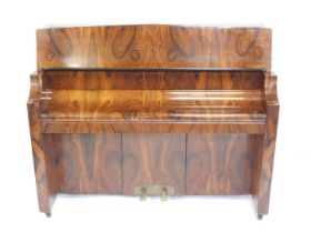 An early 20thC Bentley walnut cased upright overstrung piano, iron framed, 138cm wide.