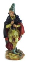 A Royal Doulton porcelain figure modelled as the Pied Piper, HN2102.