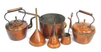 A group of 19thC and later copper and brass wares, comprising two copper kettles, one with crest for