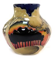 A Moorcroft pottery vase, of squat cylindrical form, decorated with trees in khaki and black against