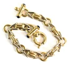 A fancy link bracelet, of bicolour design, with white and yellow metal, and two bar ends each set wi