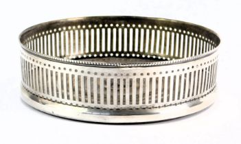 A Queen Elizabeth II silver wine coaster, the reeded border with pierced design moulding, on a turne