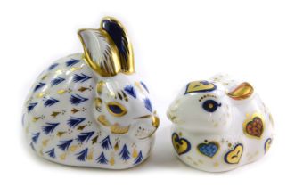 Two Royal Crown Derby porcelain rabbit paperweights, modelled as For You Rabbit, gold stopper and re