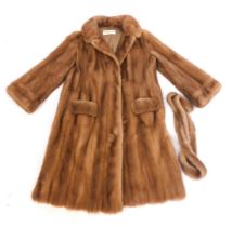 A Canadian Furs of Coventry caramel coloured three quarter length fur coat and stole.