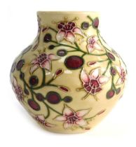 A Moorcroft pottery vase decorated in the Tembusu pattern, designed by Sian Leaper, of squat form, i