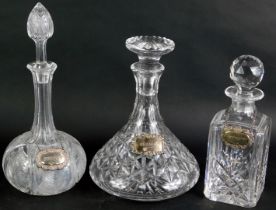 Three cut glass decanters, comprising a ship's decanter and stopper, 27cm high, square decanter and