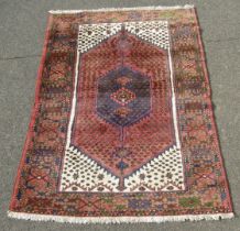 A Persian Tabriz type pink ground rug, with central medallion within a cream outer backing, within m