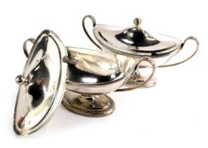A pair of 19thC crested silver plated sauce tureens, each boat shaped, with lid, bearing crest inscr