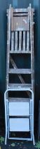 A wooden step ladder and a two step metal step ladder.
