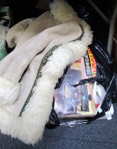 A Scalextric set, together with a sheepskin coat.