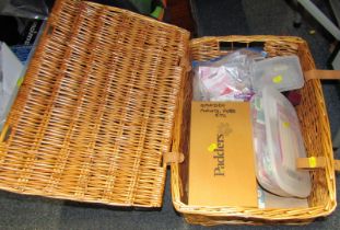 A wicker picnic hamper and contents.