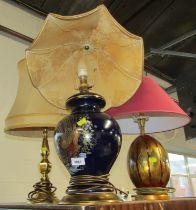 A group of table lamps, to include a pottery example of baluster form, decorated with a bird against