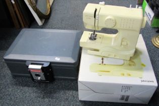 A John Lewis JL mini sewing machine, boxed, together with a Honeywell case, with key.