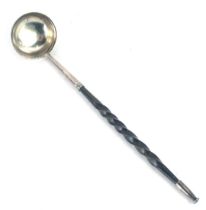 A Georgian toddy ladle, with white metal mounts, on a turned ebony handle, unmarked, 21cm long.