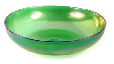An iridescent green glass bowl, possibly WMF or Loetz, 30cm diameter.