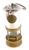 A Cambrian Works miner's lamp, in stainless steel and brass, stamped CME F11, with swing handle, 21c