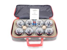 A cased set of JB lawn bowls, in material carry case.