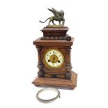 A late 19thC Hamburg Clock Company walnut cased mantel clock, circular brass dial with enamel chapte