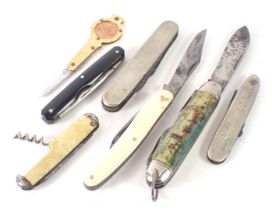 A group of pen knives, comprising two mother of pearl handled pen knives, two stainless steel pen kn