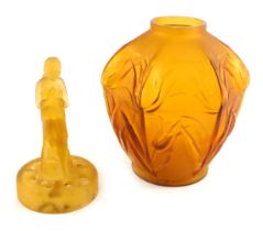 A French amber glass vase, of hexagonal form, with moulded thistles, 18cm high, and a frosted amber