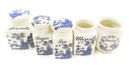 Regal Blue Willow pattern kitchen jars, comprising utensils, biscuits, tea and sugar.
