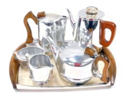 A Piquotware five piece aluminium tea set, comprising teapot, coffee pot, milk jug, sugar bowl, serv