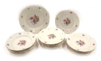 A quantity of German porcelain dinner soup plates, each printed with flower sprays, etc., on a beige