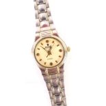 A ladies wristwatch, on stainless steel bicolour strap, with a cream coloured face, 2cm diameter.