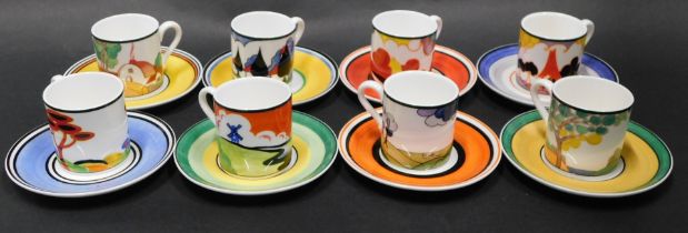 A set of eight Wedgwood Centenary Clarice Cliff coffee cans and saucers, each in multicoloured desig