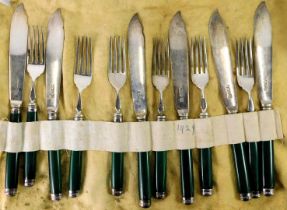 A set of six silver and stained green bone fish knives and forks, Sheffield 1929.
